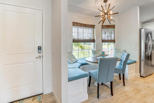 a kitchen and dining room with a table and chairs at Golf Course-Facing Poolside Oasis in Rotunda West! in Rotonda West