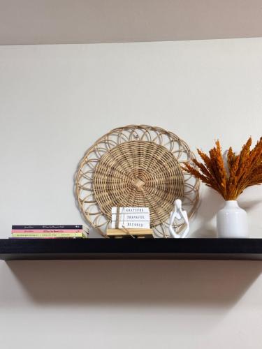 a shelf with a fan and other items on it at Condo in Lapu-Lapu City in Suba