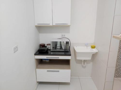 Køkken eller tekøkken på Apartamento tipo kitnet mobiliado