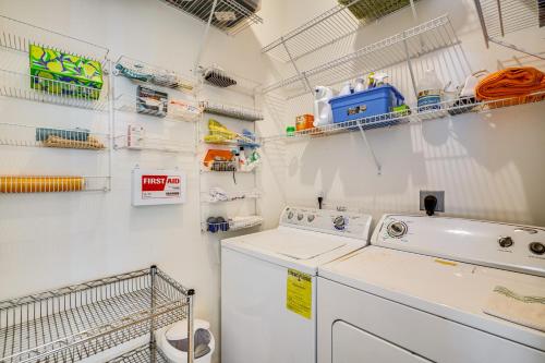 a white laundry room with a washer and dryer at 4 Mi to Beaches Fort Myers Escape with Patio in Fort Myers