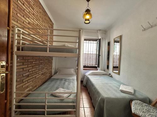 Postel nebo postele na pokoji v ubytování El balcón del Príncipe