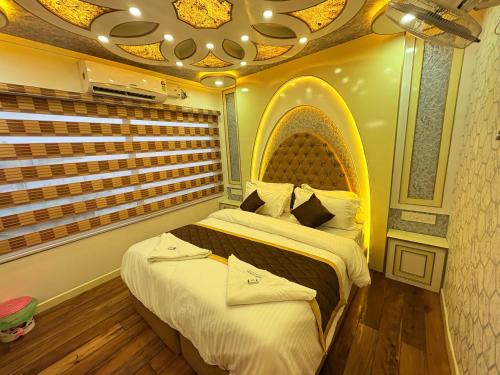 a bedroom with a large bed in a room at Green tourism Alleppey in Alleppey