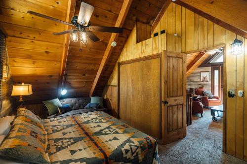 a bedroom with a bed and a ceiling fan at The Refugio #2552 in Big Bear Lake