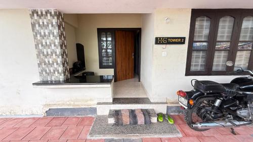 a motorcycle parked in front of a house at HG Tower 2 in Kunnamangalam