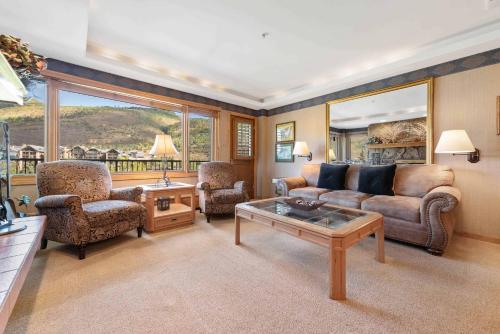 a living room with a couch and chairs and a table at Lodge Tower 594 One Bedroom Residence in Vail