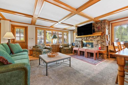 a living room with a couch and a fireplace at Lodge Tower 599 One Bedroom Residence in Vail