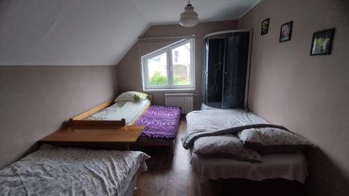 Postel nebo postele na pokoji v ubytování Tarczyny