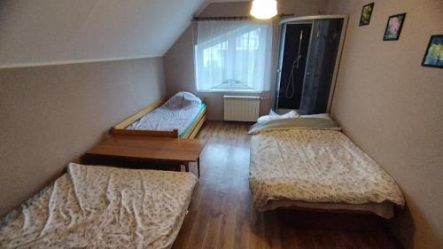 Postel nebo postele na pokoji v ubytování Tarczyny