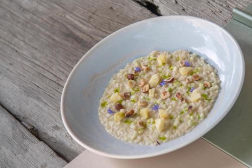 a bowl of rice with nuts and corn on it at Linara Mountain Family Stay in Valles