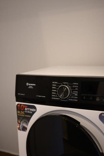 a close up of a toaster oven with a microwave at Tower Luxury Flats in Alexandroupoli