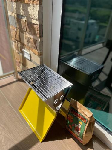 a table and a bag of food next to a window at AmazINN Places Playa Escondida in María Chiquita