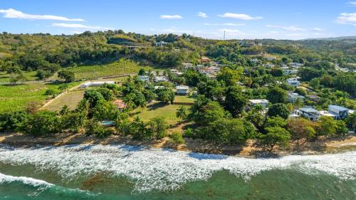 an aerial view of an island in the ocean at The Reef 1 walking disntance to Steps Beach in Rincon