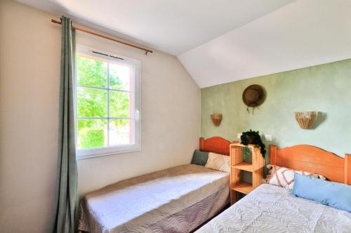 Postel nebo postele na pokoji v ubytování La résidence du Lac - maeva Home - Maison 3 pièces + coin cabine 8 personnes - Prestige MAE-5933