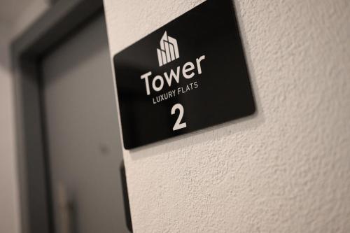 a sign on a wall that reads toweraughts at Tower Luxury Flats in Alexandroupoli