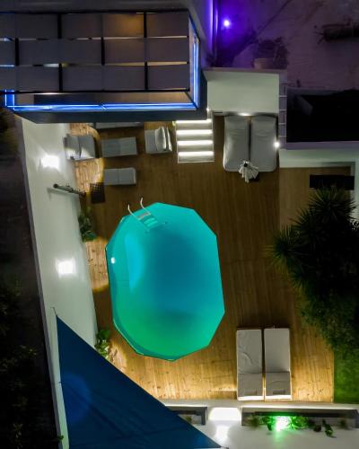 an overhead view of a house with a green table at Melydia luxury Villa in Kastamonítsa