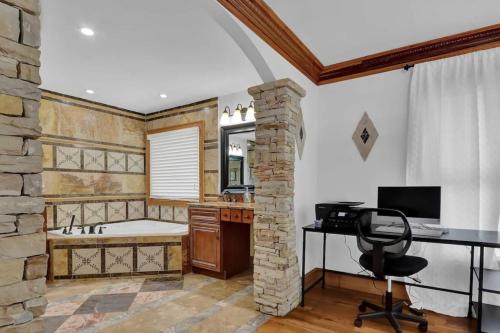 an office with a desk and a chair in a bathroom at Big 6br,4ba Home W 10-car Parking For Crewsgrps in Atlanta