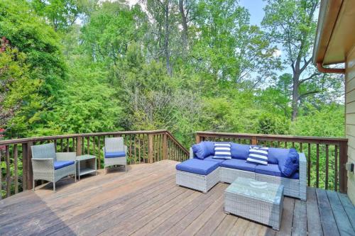 a porch with a couch and chairs on a deck at Big 6br,4ba Home W 10-car Parking For Crewsgrps in Atlanta
