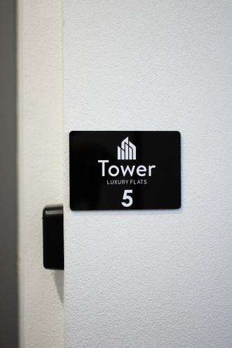 a sign on the door of a white refrigerator at Tower Luxury Flats in Alexandroupoli