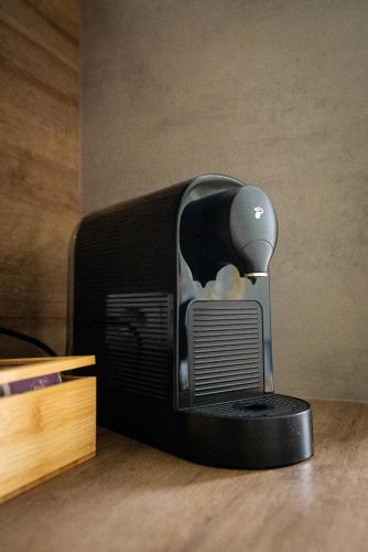 a computer monitor sitting on top of a table at BacherlHouse - Apartment Ager in Schörfling