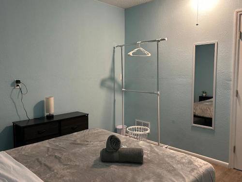 a bedroom with a bed and a dresser and a mirror at Relaxing Getaway in Sarasota Great Location Whole House in Sarasota
