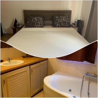 a bathroom with a bed with a sink and a tub at Villa Soazara in Koungou