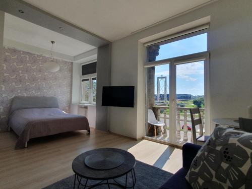 En eller flere senge i et værelse på Kaunas Center Apartments - K. Mindaugo g.