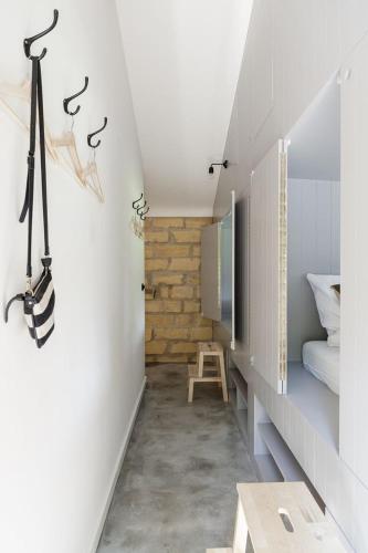 a hallway of a house with a bedroom at Vakantiehuisjes Theodorus en Josephine - Landgoed Heerdeberg- Maastricht in Cadier en Keer