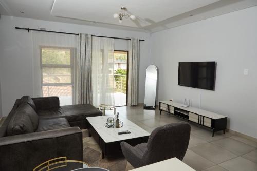 Телевизор и/или развлекательный центр в Mountain Drive Apartments