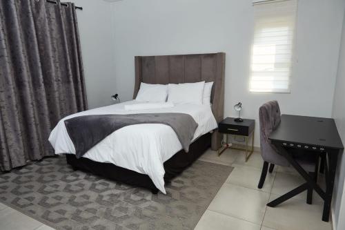 Кровать или кровати в номере Mountain Drive Apartments