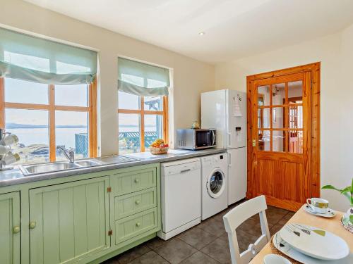 a kitchen with a sink and a dishwasher at 3 Bed in Ardvasar CA071 in Aird of Sleat