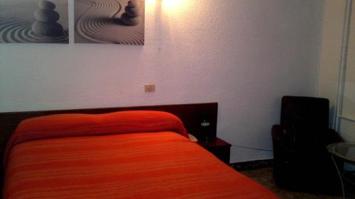 Łóżko lub łóżka w pokoju w obiekcie Hotel Peralba