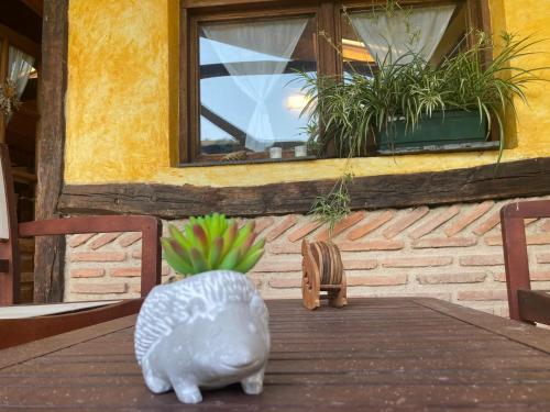 a table with a figurine of a bird on a table at BIDEARTEAN, Caserío vasco, Recién reformado in Záitegui