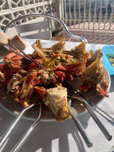 a plate of food with chopsticks on a table at Noelmar II Combarro in Combarro