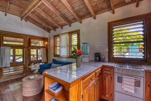 a kitchen with an island in the middle of a room at Camp Bay Lodge in Camp Bay