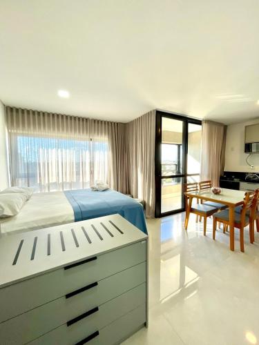 Una cama o camas en una habitación de Flat Planejado com Vista para Avenida Afonso Pena