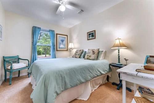 a bedroom with a bed and a window at Bayfront- 2mins from Boat Launch in Eastpoint