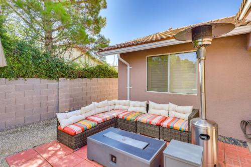 a couch sitting on the side of a house at Kingman Family Home Yard, Grill and Room to Relax! in Kingman