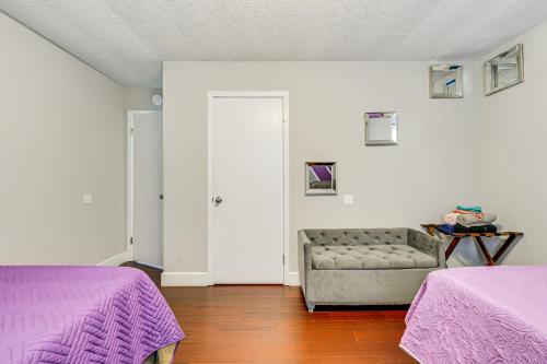 a living room with two beds and a couch at A Time to Remember Home in Tobyhanna with Pool! in Tobyhanna
