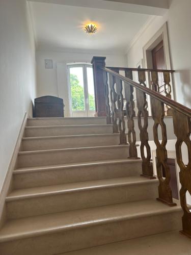 a staircase in a home with a stair case at Casa de S Bento in Santarém