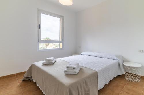 Postel nebo postele na pokoji v ubytování Valle del Este Terraza Piscina Parking Gratis