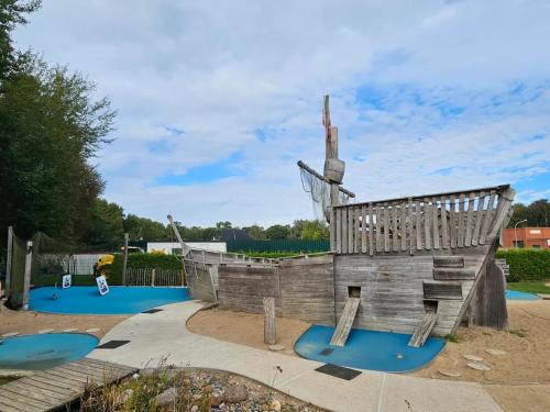 a wooden replica of a boat in a playground at Apartment in Trassenheide for 4 Personen in Trassenheide