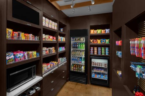 a grocery store aisle with food and drinks at Courtyard by Marriott Salt Lake City Sandy in Sandy