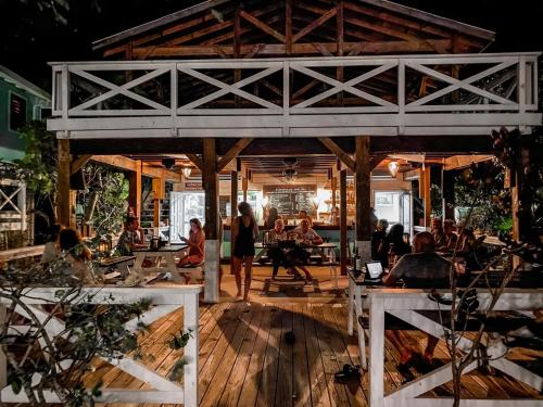 a group of people sitting at tables in a restaurant at Camp Bay Lodge in Camp Bay
