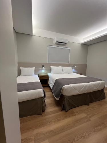 Postel nebo postele na pokoji v ubytování Real Palace Hotel