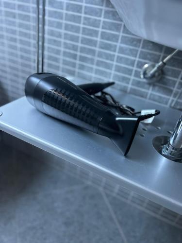 a black brush sitting on top of a counter at Cadorna36 in Locri