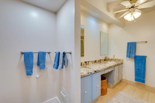 a bathroom with two sinks and a mirror at 50 Feet to Ocean Kona Deluxe Ground-Floor Unit! in Kailua-Kona