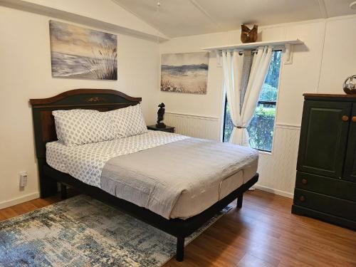 a bedroom with a bed and a window at Imma Place in Trenton