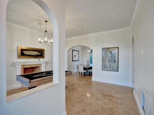 a living room with a fireplace and a piano at Casa Fina Miami Near Beaches 