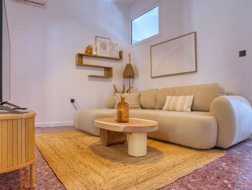 a living room with a couch and a table at Acropolis & Sea View Villa with Whirlpool & BBQ in Athens