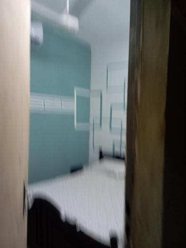 a bedroom with a bed in a room at Hollande House Blm in Ouagadougou
